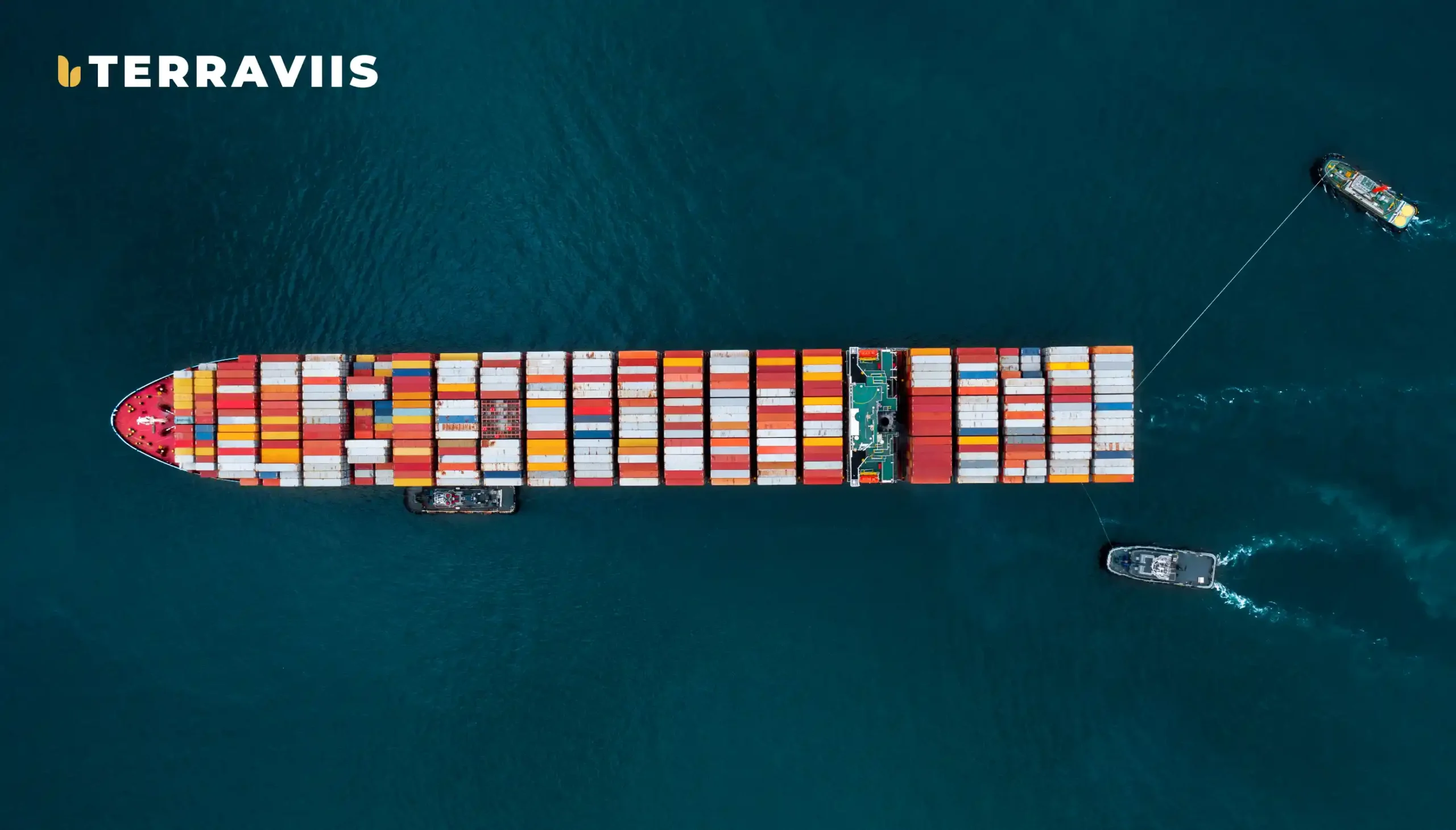 Aerial view of cargo ship transporting agricultural commodities with Terraviis IoT logistics tracking.